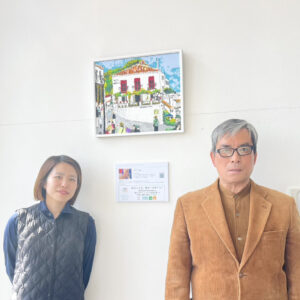 納品したアーティスト・グラの作品と、TANIGAWAの方（左）とアーティスト・川上岳史